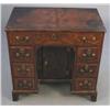 Image 1 : An early 18th century walnut kneehole desk, fitted with nine drawers about a central recess cupbo...