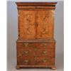 Image 1 : An early 18th century walnut cabinet on chest, fitted with a frieze drawer over a pair of doors e...