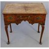 Image 1 : A George I cross banded walnut and herring bone inlaid lowboy, with three drawers over a shaped a...