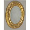 Image 1 : An 18th century oval wall mirror, with a foliate carved giltwood frame, the plate 11ins x 9ins...