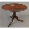 Image 1 : A Regency mahogany oval centre table, with turned column on splayed tripod base with brass termin...