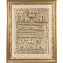 A George III sampler, finely worked with a variety of silk stitches and chenille detail with mora...