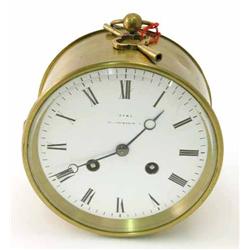 A brass drum clock by Dent, Cockspur Street, with moon hands, enamelled dial and bell striking mo...