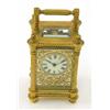 Image 1 : A gilt brass carriage timepiece, with enamelled dial and filigree surround, movement signed R & C...