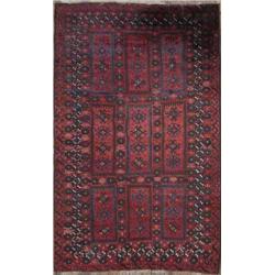 A Belouchi, NE Persian rug, wine red field with central repeating panels of hooked medallions 6ft...