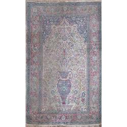 An Isphahan prayer rug, the cream mihrab filled with a vase of blossoming flowers within a red sc...