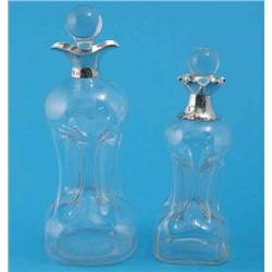 Two Victorian hour glass decanters and stoppers, with silver collars, Birmingham 1887 and London...