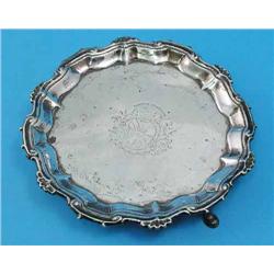 A George II silver waiter, with scroll and shell border and engraved armorial, maker William Peas...