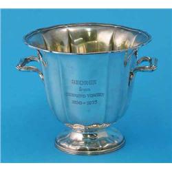 An Edwardian silver twin handled pedestal bowl, with fluted sides and reeded rim and base, Sheffi...