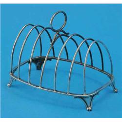 A William IV silver six division toast rack, with loop handle and scroll feet, maker Robert Henne...