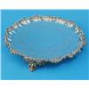 Image 1 : A Victorian silver salver, with shell and scroll border, engraved decoration and scroll feet, mak...