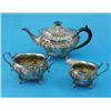 Image 1 : A Victorian three piece silver tea set, of shaped oval form, decorated throughout with engraved a...