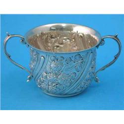 A Victorian small silver porringer, with twin scroll handles and spiraling fluted and foliate dec...