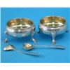 Image 1 : A pair of George III silver bun salts, on scroll feet, London 1772, and a pair of later spoons wi...