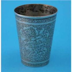 A Persian white metal beaker, engraved with panels of birds and figures within a foliate border,...