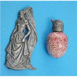 A novelty silver lidded scent bottle, the lid modelled as a sparrow head, the body as an egg with...