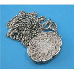 A Victorian silver vinaigrette, of shaped oval form, decorated throughout with engraved acanthus...