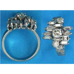 A white gold dress ring, claw-set with baguette and brilliant-cut diamonds on a textured bark eff...