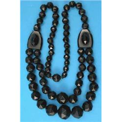 A Victorian jet necklace, the front with 2 rows of graduated faceted beads on a single back row o...