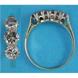 A 3-stone diamond ring, the brilliant cut stones claw-set in 18ct gold and platinum, total weight...