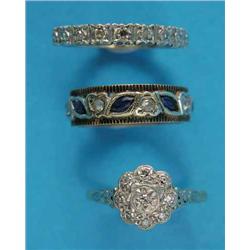 An 18ct gold illusion-set diamond cluster ring, a 9ct gold diamond set half eternity ring and a 9...