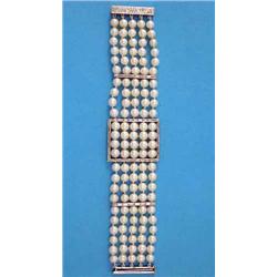 A 5-row uniform cultured pearl bracelet, the buckle design front and the 2 spacer bars set baguet...