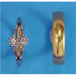 An 18ct gold and platinum 2-stone diamond ring, and a 22ct gold wedding ring...