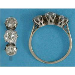 A 3-stone diamond ring, claw-set in white gold, the centre stone approximately .8ct...