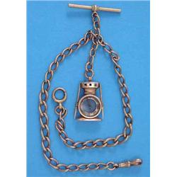 A Victorian 9ct gold albert, with novelty 'miners lamp' gold fob compass, total weight 34.5grms...