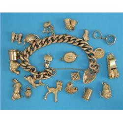 A 9ct gold curb link bracelet, with padlock clasp and 7 attached 9ct gold charms and 13 loose cha...