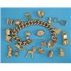 Image 1 : A 9ct gold curb link bracelet, with padlock clasp and 7 attached 9ct gold charms and 13 loose cha...