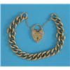 Image 1 : A 9ct gold curb link bracelet, with engraved padlock clasp, 44.5grms...