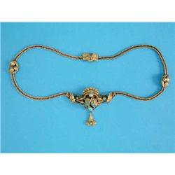 A late 19th century Continental gold necklace, the centre front decorated with chased scrolls and...