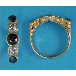 A modern gold half hoop ring, collet set with 3 round-cut sapphires and 2 diamonds...