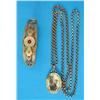 Image 1 : A 9ct gold (front and back) oval pendant locket, set with a ruby and seed pearls on 9ct gold chai...