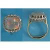 Image 1 : An 18ct gold ring, claw-set with a cushion shaped opal bordered by 16 round-cut diamonds...