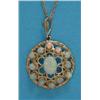 Image 1 : A gold openwork circular pendant, set with a central oval opal bordered by 12 round opals, on fin...