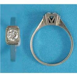 An Art Deco 18k white gold solitaire diamond ring, set with a brilliant cut diamond...