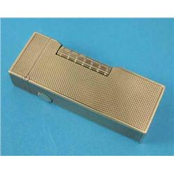 A Dunhill 9ct gold cased Rollalite type cigarette lighter, with engine turned decoration, in leat...