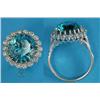 Image 1 : A blue zircon and diamond circular cluster ring, claw-set in 18ct white gold...