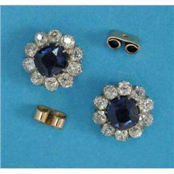 A pair of sapphire and diamond cluster earrings, each claw-set with a cushion shaped cornflower b...