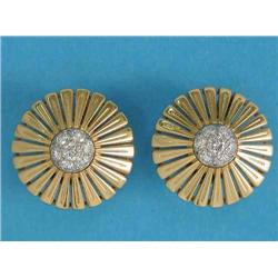 A pair of 18ct gold and diamond earrings, each designed as a stylised circular flowerhead with a...
