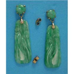 A pair of gold mounted carved jade drop earrings...