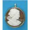 Image 1 : A gold framed circular shell cameo brooch/pendant, carved with a profile study of a lady wearing...