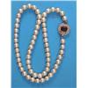 Image 1 : A single row necklace, of uniform cultured pearls, the hexagonal white gold clasp set with a rect...