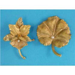 An 18k 2-colour gold leaf shaped brooch, set with a pearl and a similar 'orchid' brooch...