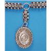 Image 1 : A late Victorian silver pendant locket, the front embossed with a horseshoe, on a matching collar...