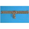 Image 1 : An 18k gold wide flexible bracelet, of fancy linking, the front with a tassel motif set 5 rubies,...