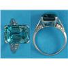Image 1 : A white gold dress ring, claw-set with a rectangular cut blue zircon, the split shoulders set sma...