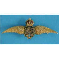 A 9ct gold snake link necklace, 58.4grms, and a 9ct gold and enamel RAF lapel brooch...